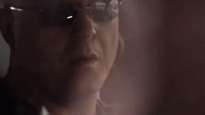 Man In Sunglasses Talking On Cellphone GIF