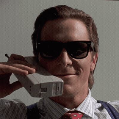 Man In Sunglasses Talking On Cellphone GIF