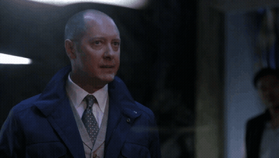 Man In Sunglasses Talking To Another Man With NBC Logo GIF