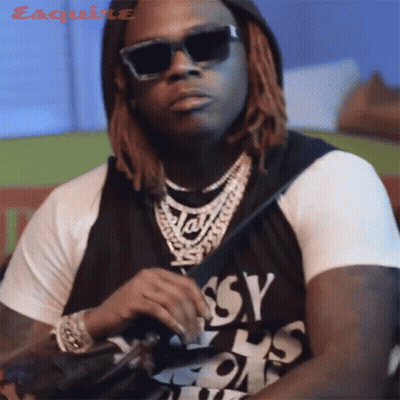 Man In Sunglasses Wearing Assy Shirt GIF