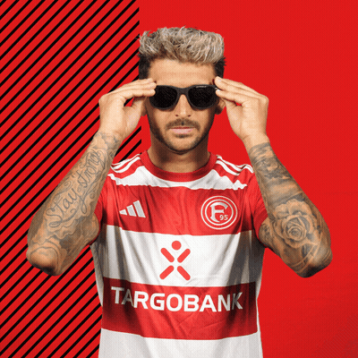 Man in Sunglasses Wearing Targobank Jersey