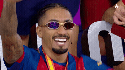 Man In Sunglasses With Medal Smiling GIF