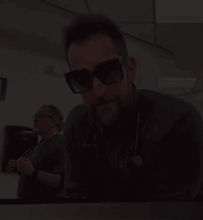 Man In Sunglasses With Stethoscope Saying NC GIF
