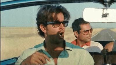 Man In Sunglasses Yawning In Car With Two Men GIF