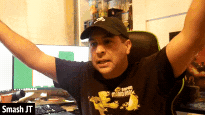Man In Super Mario Bros Shirt Sitting At Computer GIF