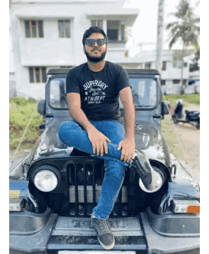 Man In Superdry Shirt Sitting On Black Jeep Sticker