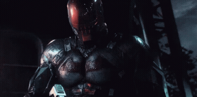Man In Superhero Costum Attacked By Red Lasers GIF