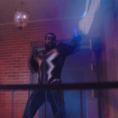 Man In Superhero Costume Holding Blue Light GIF
