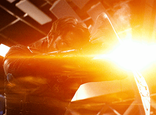 Man In Superhero Costume Holding Shield GIF