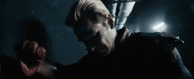 Man In Superhero Costume Holding Sword GIF