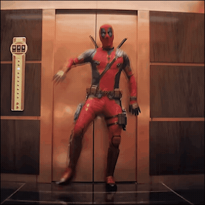 Man In Superhero Costume In Elevator GIF
