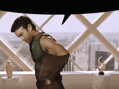 Man In Superhero Costume In Front Of Window GIF