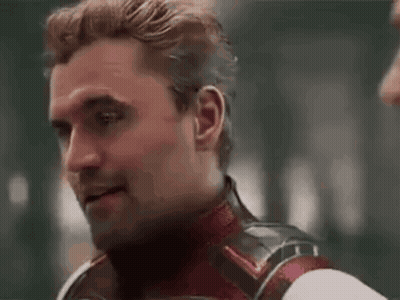 Man In Superhero Costume Looking At Another Man GIF
