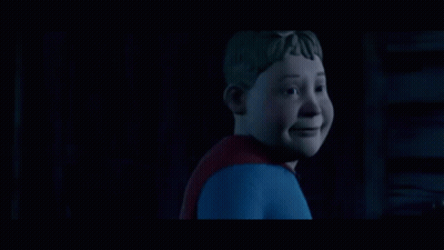 Man In Superhero Costume Looking Up In Dark GIF
