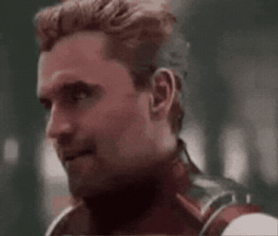 Man In Superhero Costume Making Face GIF