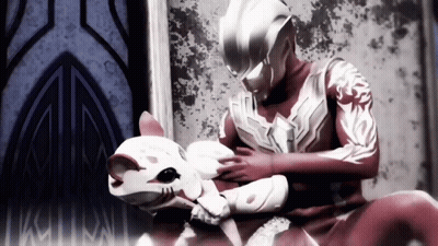 Man In Superhero Costume Petting Cat GIF