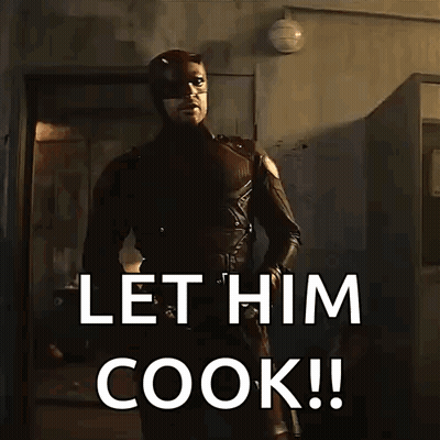 Man In Superhero Costume Saying Let Him Cook GIF