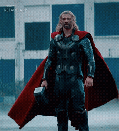 Man In Superhero Costume Standing In Sand GIF
