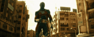 Man In Superhero Costume Walking GIF