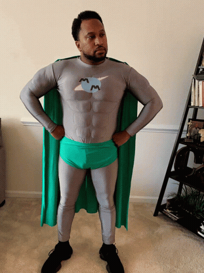 Man In Superhero Costume With M On Chest GIF