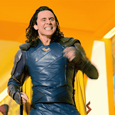 Man In Superhero Costume With Yellow Cape Smiling GIF