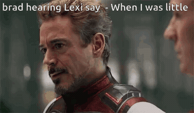 Man In Superhero Suit Talking To Another Man GIF