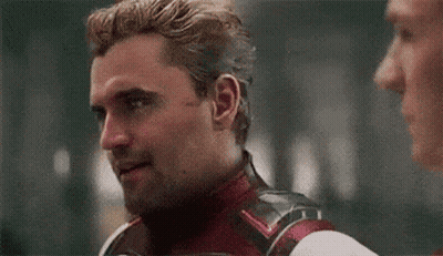 Man In Superhero Suit Talking To Another Man GIF