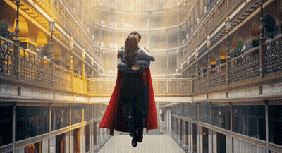 Man In Superman Cape Carrying Woman GIF