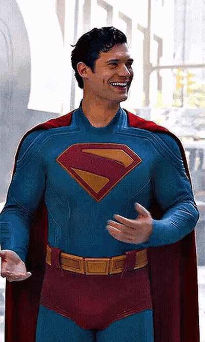 Man In Superman Costume And Cape Smiling GIF