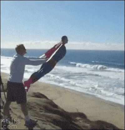 Man In Superman Costume Being Lifted GIF