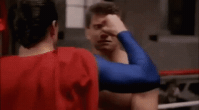 Man In Superman Costume Boxing GIF