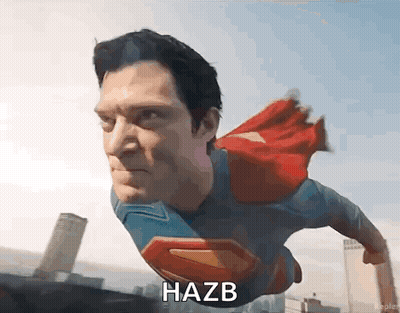 Man In Superman Costume Flying With Word Hazb GIF