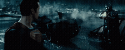 Man In Superman Costume Holding Gun In Water GIF
