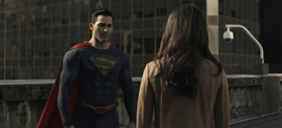 Man In Superman Costume Hugging Woman GIF