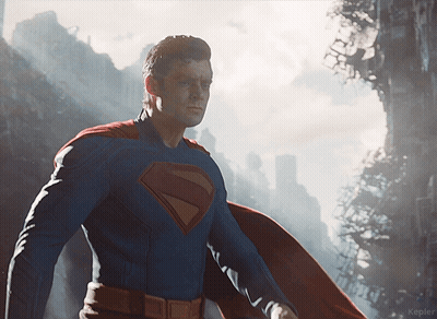 Man In Superman Costume In Front Of City GIF