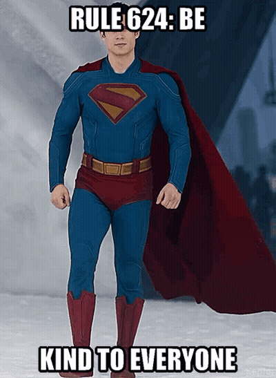 Man In Superman Costume Laying On Bed GIF
