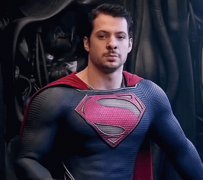 Man In Superman Costume Looking At Camera GIF