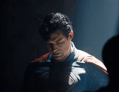 Man In Superman Costume Looking Down GIF