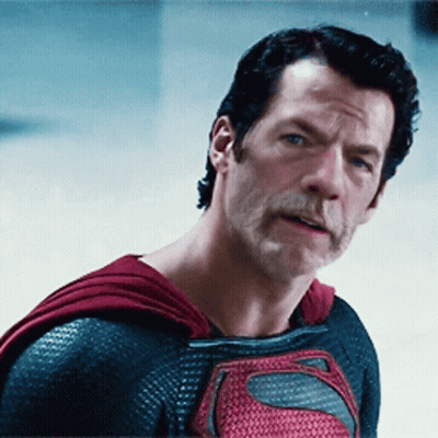 Man In Superman Costume Standing By News Box GIF