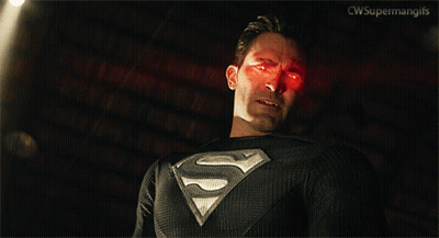 Man In Superman Costume Standing By Pile Of Boxes GIF