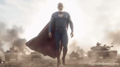 Man In Superman Costume Walking GIF