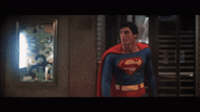 Man In Superman Costume With Letter S On Chest GIF