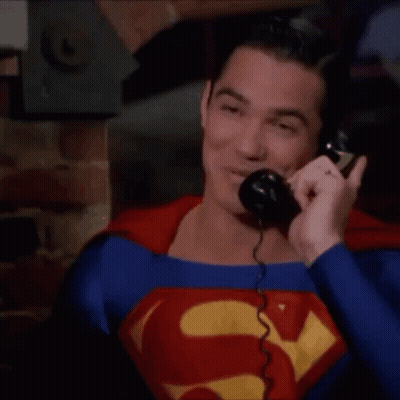Man In Superman Suit Talking On Phone GIF