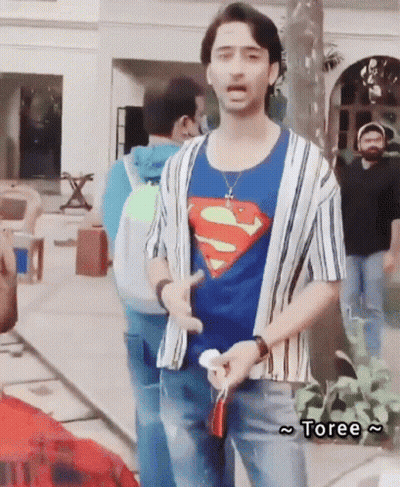 Man In Superman T-Shirt Standing Before Group GIF
