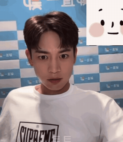 Man In Supreme Shirt Looking At Camera GIF