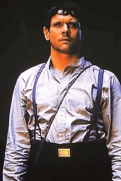 Man In Suspenders And White Shirt With Yellow Badge GIF