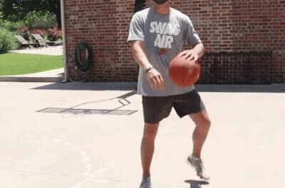 Man In Swan Air Shirt Dribbling Basketball GIF