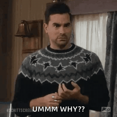 Man In Sweater Asking Why On Phone GIF