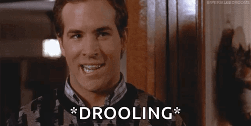 Man In Sweater Drooling GIF