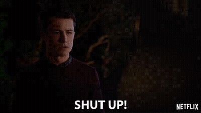 Man In Sweater In Front Of Shut Up Sign GIF